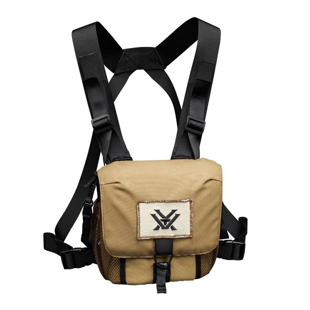 Beige Brusttasche mit verstellbaren schwarzen Gurten und aufgesticktem Logo, ideal für Abenteuer und Outdoor-Aktivitäten